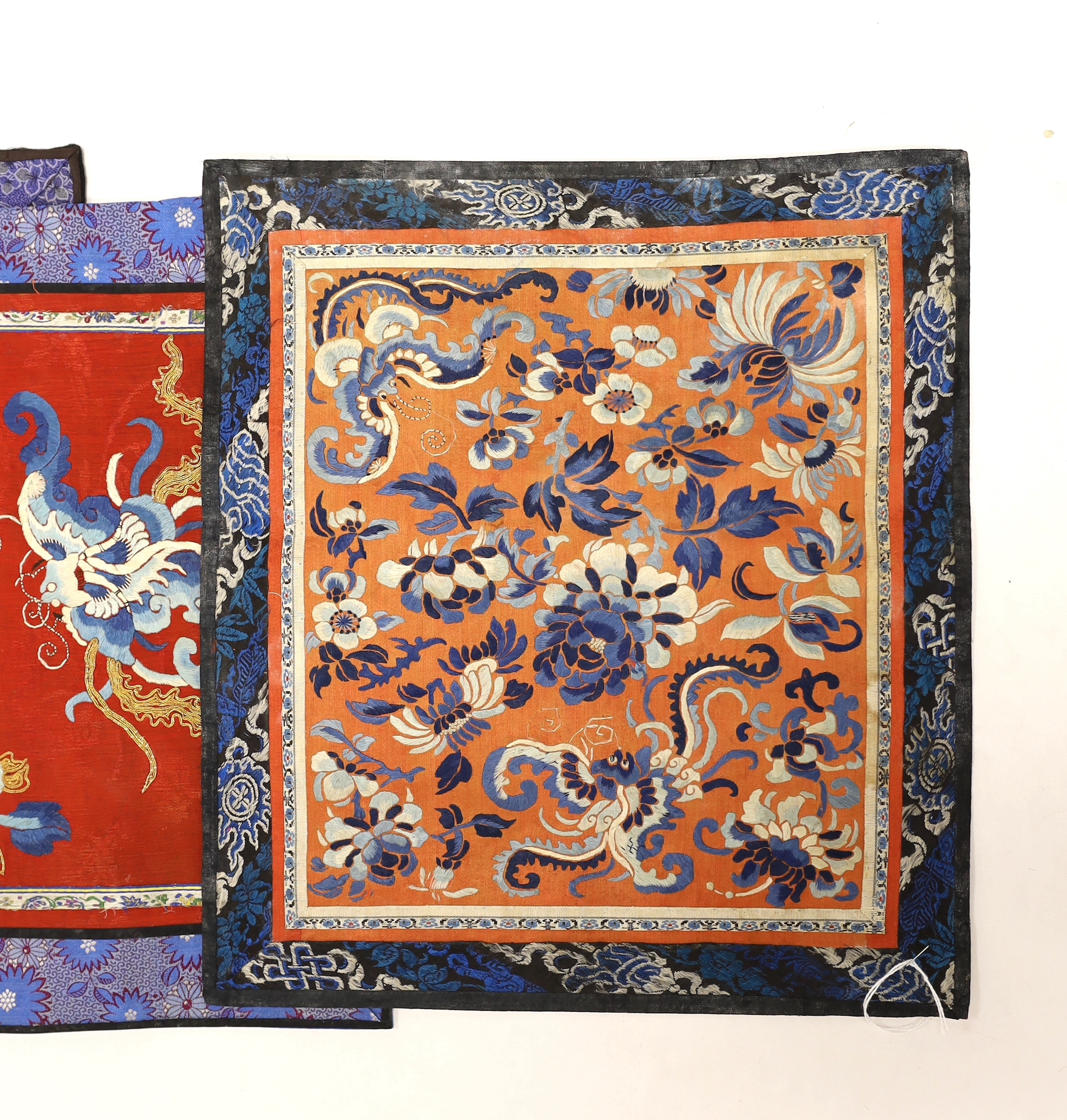 Nine Chinese silk embroidered panels, framed with silk damask borders, circa 20th century, largest 37cm x 41cm